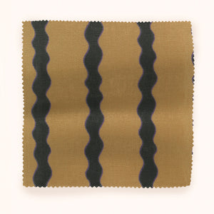 Scroll Stripe linen by Parker and Jules in beige, draped close-up of wavy scroll stripes