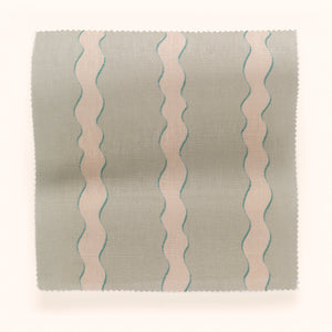 Scroll Stripe linen by Parker and Jules in cream and teal, draped, showing wavy scroll stripes