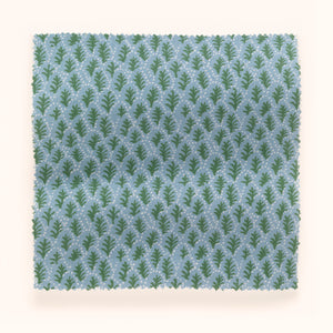 Trees II linen by Parker and Jules in blue, in soft folds showing tiny stylised trees