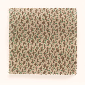 Trees II linen by Parker and Jules in beige, draped, showing tiny stylised trees