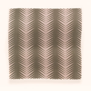 Ziggy linen by Parker and Jules in pink and green, in soft folds showing a chevron zigzag weave