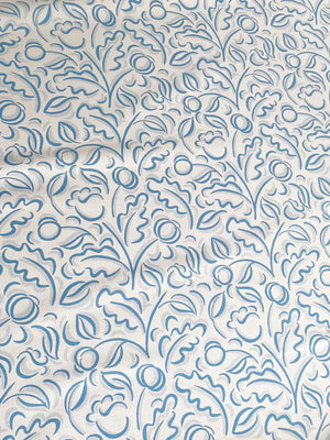 Faustine linen by Claire de Quénetain in blue, full repeat of leafy scrolls