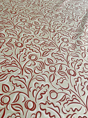Faustine linen by Claire de Quénetain in red, draped, showing leafy scrolls