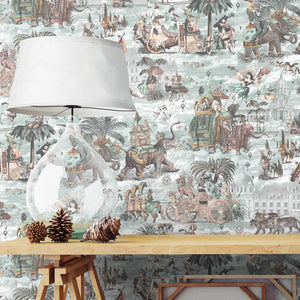 Fiesta wallpaper by Brand McKenzie in peach, a festive procession of elephants behind a console table