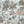 Fiesta wallpaper by Brand McKenzie in cream, pattern detail of a festive procession of elephants