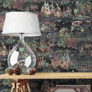 Fiesta wallpaper by Brand McKenzie in red and green, a festive procession of elephants behind a console table