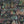 Fiesta wallpaper by Brand McKenzie in charcoal, detail of a festive procession of elephants