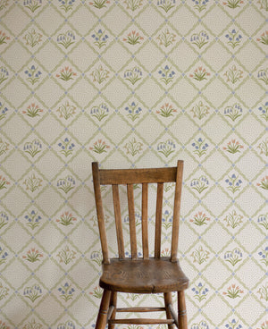First Signs wallpaper by Studio Le Cocq in brown, a floral trellis in a styled room setting