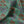 Fleur velvet by Tatie Lou in sage green, draped, showing stylised flower sprays