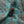 Fleur velvet by Tatie Lou in teal, in soft folds showing stylised flower sprays