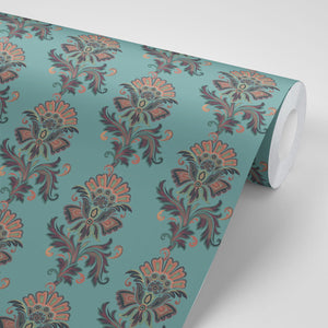 Fleur wallpaper by Tatie Lou in teal, partly unrolled roll showing stylised flower sprays