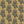 Fleur wallpaper by Tatie Lou in mustard, sample roll showing stylised flower sprays