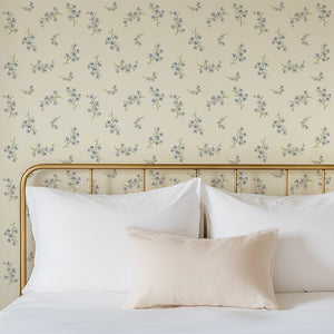 Forget Me Not wallpaper by Seed Home Designs in cream, scattered forget-me-nots in a bedroom