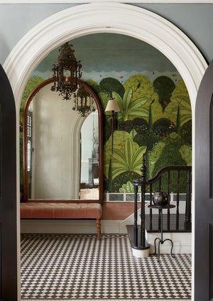 Gardenia wallpaper by Deus ex Gardenia in green, large tropical leaves in a hallway