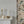 French Grey grasscloth grasscloth by Deus ex Gardenia in grey, a woven grasscloth texture above a sideboard