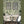 Treetop Green grasscloth grasscloth by Deus ex Gardenia in green, a woven grasscloth texture in a dining area