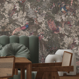Gentlemen Birds wallpaper by Brand McKenzie in dusky pink, birds hidden among leaves behind a dining table