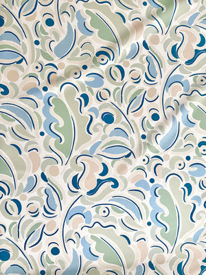 Gloria linen by Claire de Quénetain in beige, draped, showing scattered leaves