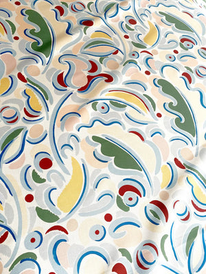 Gloria linen by Claire de Quénetain in red, in soft folds showing scattered leaves