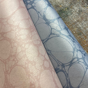 Moucheté wallpaper by House of Amitié in pink, roll showing soft marbled spots