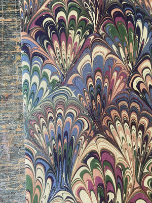 Serpentine wallpaper by House of Amitié in pink and blue, flat sample of peacock-feather marbling