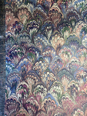 Serpentine wallpaper by House of Amitié in pink and blue, full repeat of peacock-feather marbling