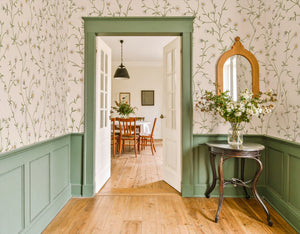 Daisy Chain wallpaper by Studio Le Cocq in cream, trailing daisy chains in an entryway