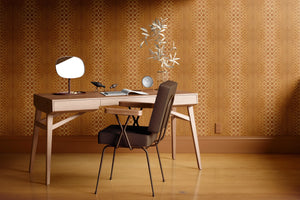 Halo Boulevard wallpaper by Liberty James Studio in gold, a geometric halo pattern behind a desk in a home office
