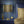 Halo Boulevard wallpaper by Liberty James Studio in navy, a geometric halo pattern in a bedroom