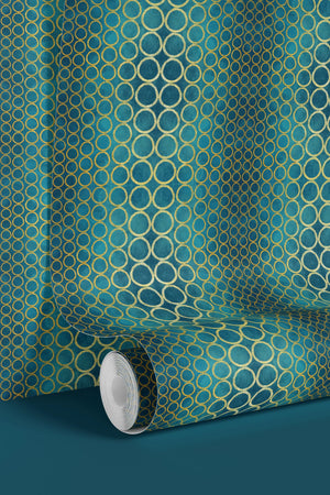 Halo Boulevard wallpaper by Liberty James Studio in teal, partly unrolled roll showing a geometric halo pattern