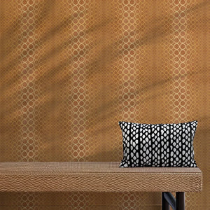 Halo Boulevard wallpaper by Liberty James Studio in gold, a geometric halo pattern behind a console table