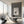 Halo Boulevard wallpaper by Liberty James Studio in silver, a geometric halo pattern in a living room