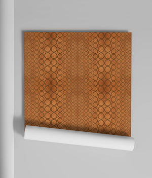 Halo Boulevard wallpaper by Liberty James Studio in brown, sample roll showing a geometric halo pattern