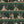 Happy Hour wallpaper by Brand McKenzie in green, detail of animals at a cocktail bar