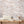 Hidden Clouds wallpaper by Brand McKenzie in pink, clouds with hidden animals on a hallway wall