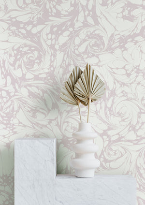 Flourish wallpaper by House of Amitié in pink, flowing scrolls on a feature wall