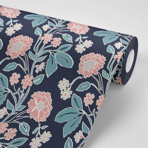 Honiton Lace wallpaper by Annika Reed in navy and pink, roll showing lace-style flowers