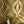 Hourglass wallpaper by Liberty James Studio in green and gold, sample roll showing a retro hourglass wave