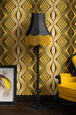 Hourglass wallpaper by Liberty James Studio in black and gold, a retro hourglass wave behind a sofa in a living room