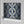 Hourglass wallpaper by Liberty James Studio in blue and silver, roll showing a retro hourglass wave