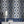 Hourglass wallpaper by Liberty James Studio in blue and silver, sample roll showing a retro hourglass wave