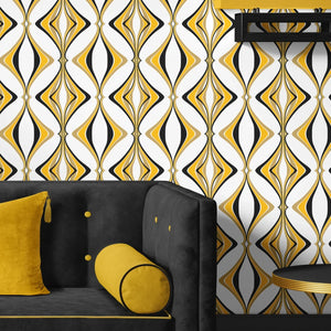 Hourglass wallpaper by Liberty James Studio in yellow and black, a retro hourglass wave behind a sofa in a living room