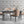Hourglass wallpaper by Liberty James Studio in grey, a retro hourglass wave in a living room