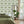 Hourglass wallpaper by Liberty James Studio in green, a retro hourglass wave on a feature wall