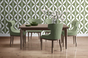 Hourglass wallpaper by Liberty James Studio in green, a retro hourglass wave behind a bed