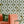 Hourglass wallpaper by Liberty James Studio in green, sample roll showing a retro hourglass wave
