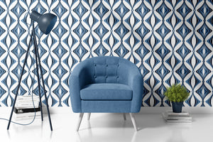 Hourglass wallpaper by Liberty James Studio in blue, partly unrolled roll showing a retro hourglass wave