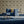 Hourglass wallpaper by Liberty James Studio in navy and gold, a retro hourglass wave on a living room wall