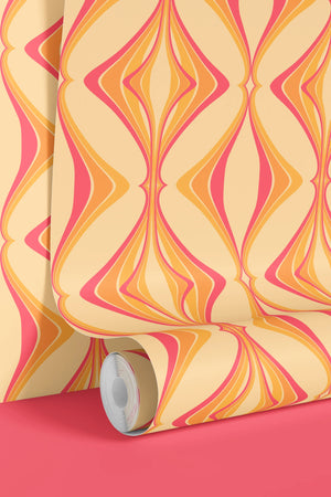 Hourglass wallpaper by Liberty James Studio in orange and pink, sample roll showing a retro hourglass wave