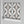 Hourglass wallpaper by Liberty James Studio in grey, a retro hourglass wave in an interior setting